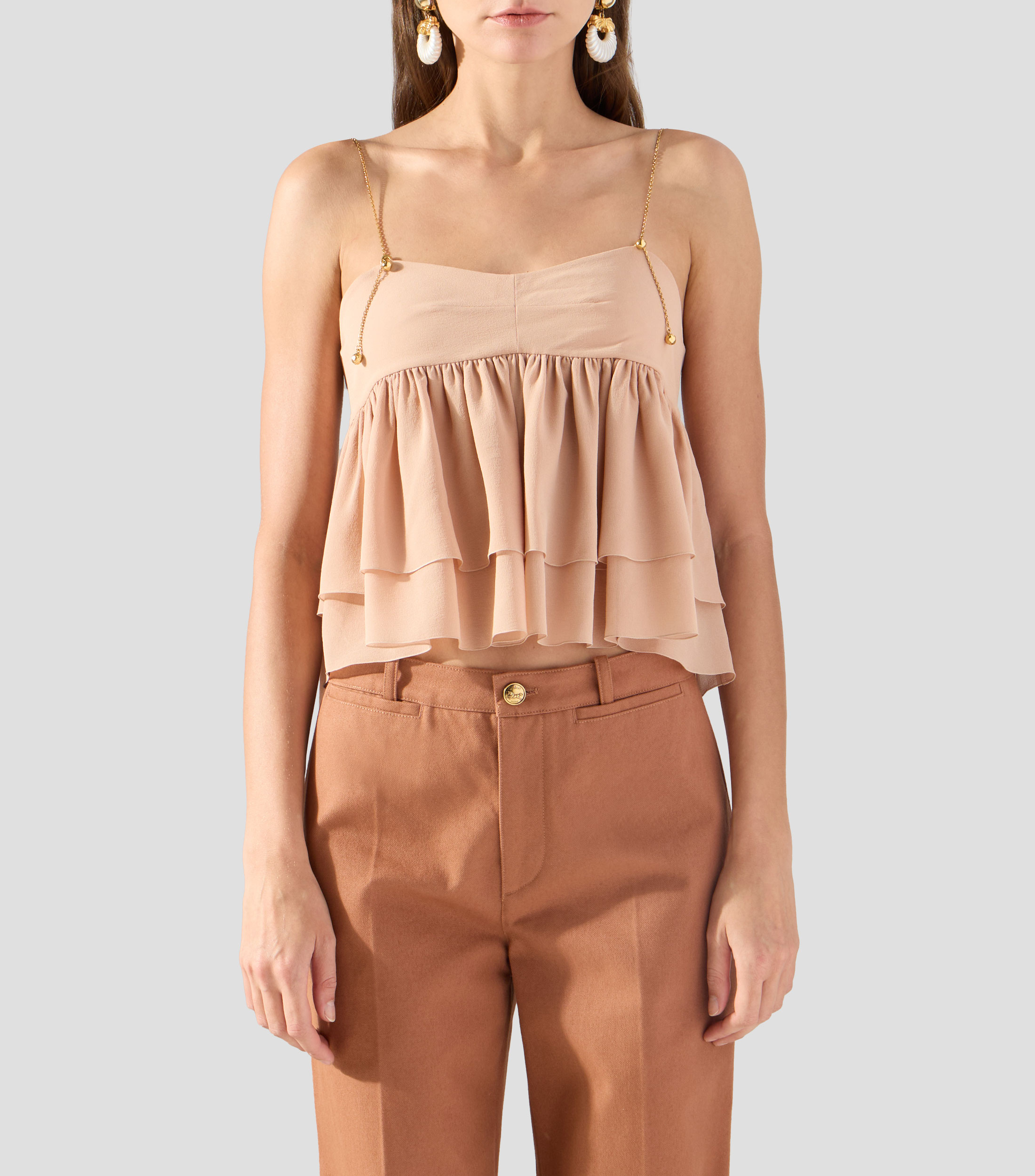 Blusa lisa sin mangas Mujer